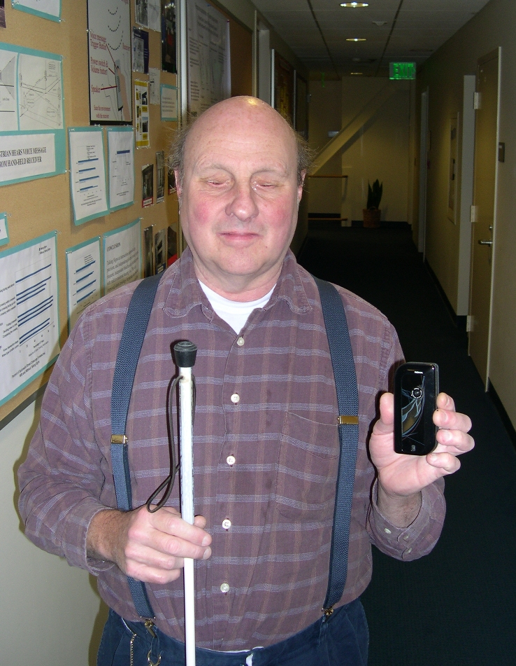 picture of Bill Gerrey holding a cell phone for navigation
