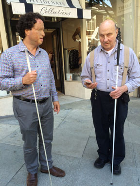 Bill Gerrey and Josh Miele talking on the sidewalk
