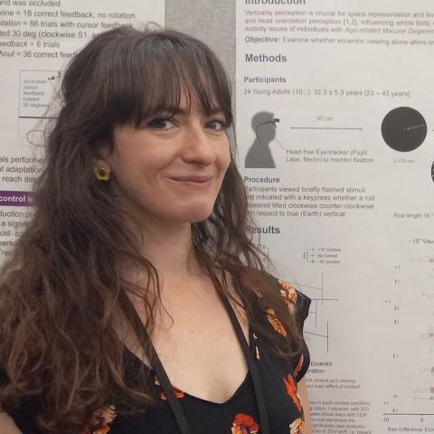 Dr. Agathos in front of her poster "Eccentric Viewing Shifts Subjective Visual Vertical Perception"