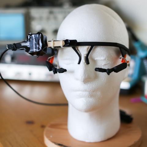 Experimental equipment: head-mounted eye-tracking goggles and head movement sensor 