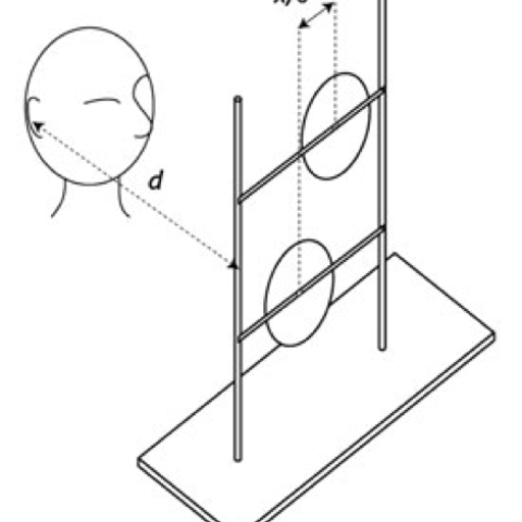 Line drawing of a person facing a rig supporting two circular echo reflectors