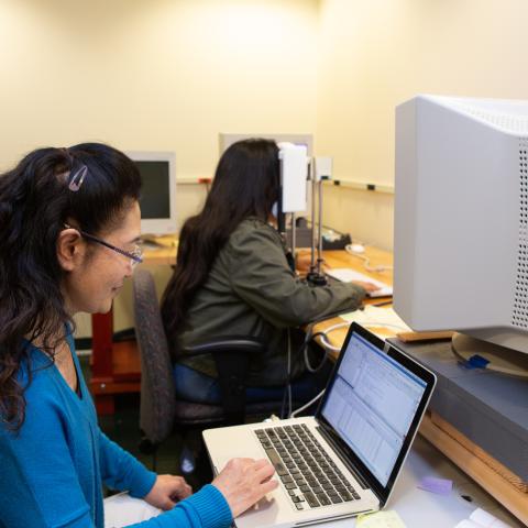 researchers looking at a computer monitor