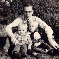 Black and white photo of a young Dr. Colenbrander with his two sons