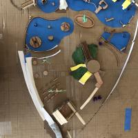 Top down view of a physical model of the Magical Bridge playground layout