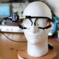Experimental equipment: head-mounted eye-tracking goggles and head movement sensor 