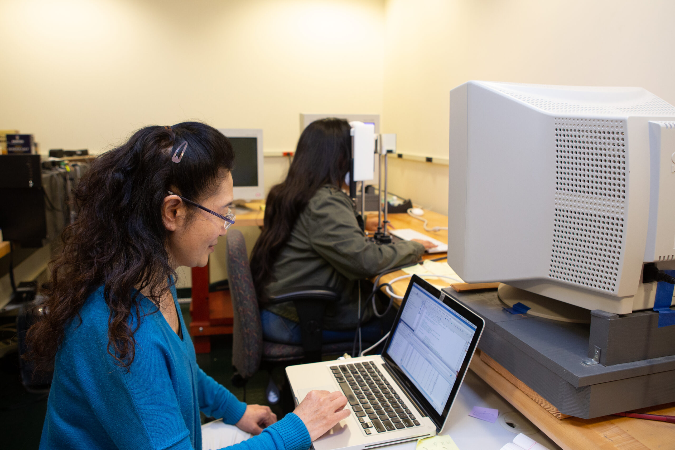 researchers looking at a computer monitor