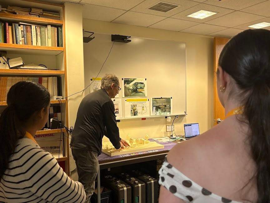 Scientist James Coughlan demonstrates a 3D tactile map to Summer Springboard students.