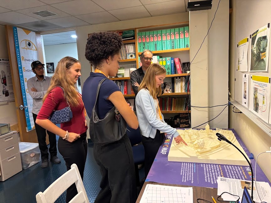 Summer Springboard neuroscience students examine a 3D tactile map with scientist James Coughlan at the Smith-Kettlewell Eye Research Institute in San Francisco.
